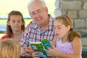 Larry reading with kids.