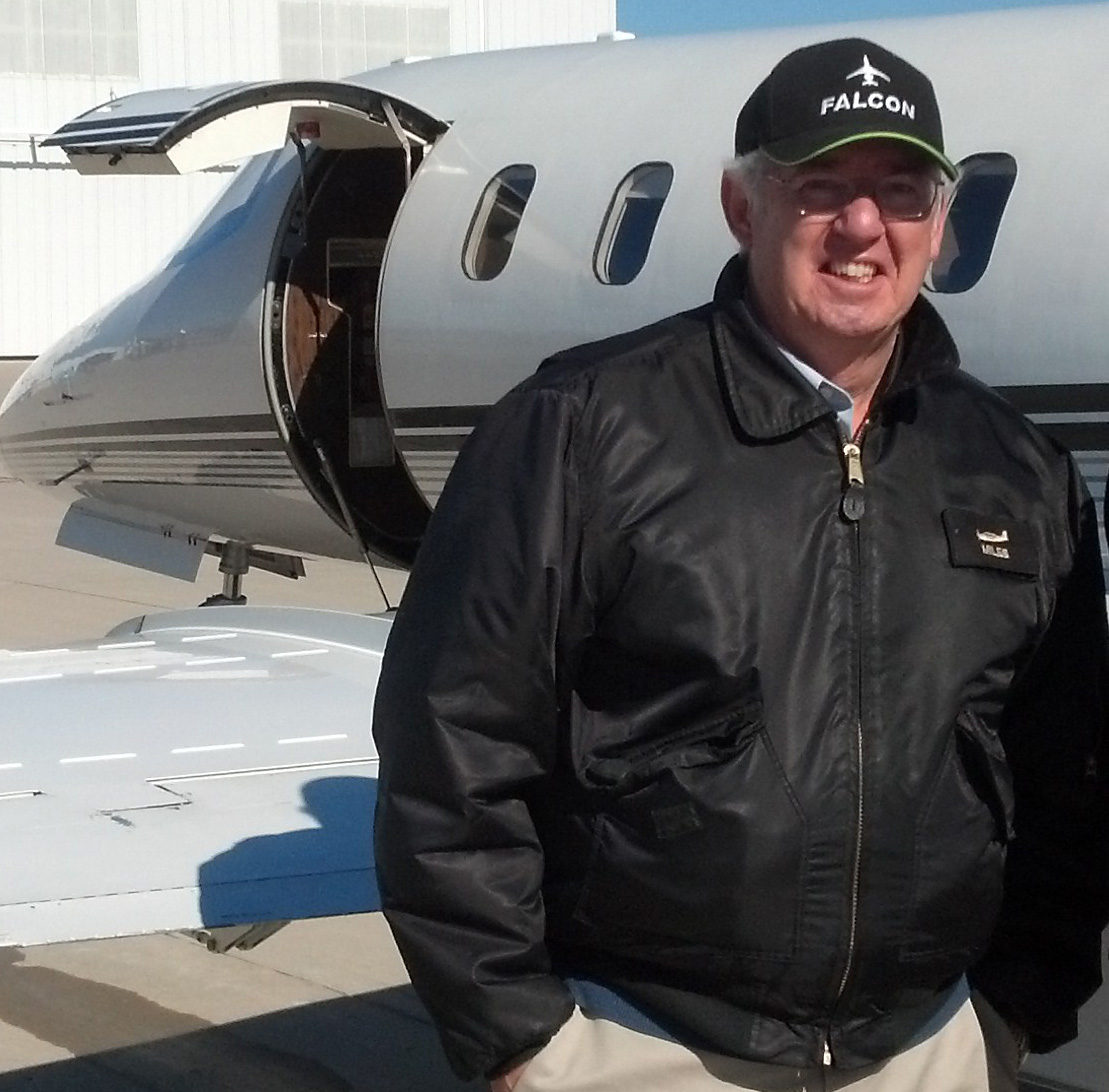 Larry Miles in front of Lear 35